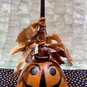 Vintage oil cans Halloween old parade lantern man face decorated vintage style Halloween folk art primitive