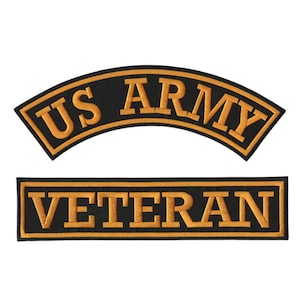 May include: Two embroidered patches with black backgrounds and gold-coloured borders and lettering. The top patch is arched with the text US ARMY, while the bottom patch is rectangular and features the word VETERAN in a bold, block-style font.