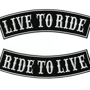 May include: Two black, arched patches with white embroidered text. The top patch reads "LIVE TO RIDE," and the bottom patch reads "RIDE TO LIVE." The patches have a white border.