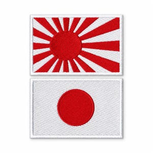 May include: Two rectangular embroidered patches. The top patch features a red sun with sixteen red rays extending to the edges on a white background. The bottom patch displays a solid red circle centered on a white background with a stitched border.
