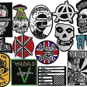May include: A collection of embroidered patches featuring various punk rock band logos, skulls, and political slogans. Designs include Dead Kennedys, Sex Pistols, The Vandals, Subhumans, AFI, and Misfits imagery, alongside an anarchy symbol and a flag graphic.