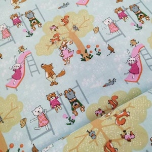 May include: Pale blue fabric with a whimsical print of cartoon animals at a playground. The design includes squirrels, rabbits, cats, and bears on slides and monkey bars, set against a backdrop of trees and flowers.