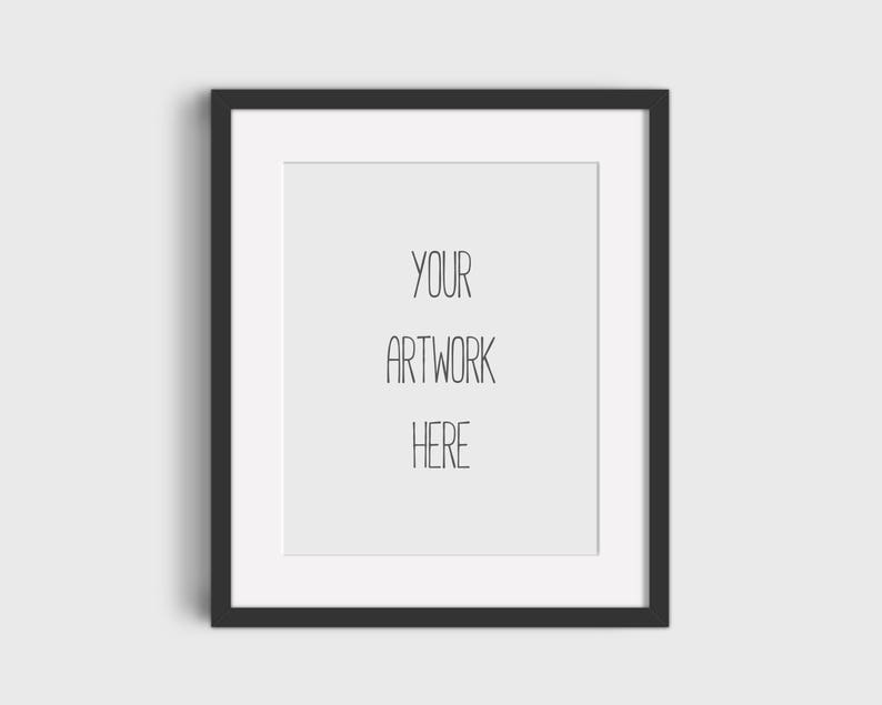 May include: A black picture frame with a white mat and the text "YOUR ARTWORK HERE" inside the frame.
