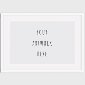May include: A white rectangular picture frame with a white border. The frame contains the text "YOUR ARTWORK HERE" in a simple, black font, centered on a light gray background. The frame is designed to display artwork.