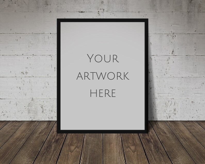 May include: A black picture frame with a white mat and the text "YOUR ARTWORK HERE" on a white brick wall background.