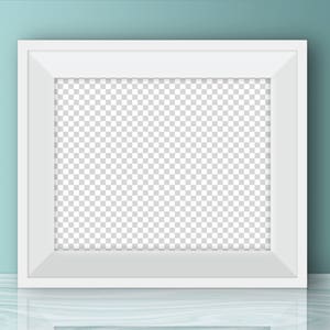 May include: A white picture frame with a blank space for a photo or artwork. The frame is sitting on a light blue surface.