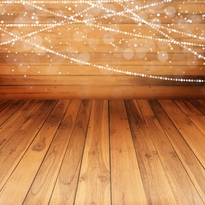 May include: A wooden floor with a warm brown color. The floor is made of planks that are arranged in a horizontal pattern. The floor is lit by a string of lights that are strung across the ceiling. The lights create a soft, warm glow that illuminates the floor.