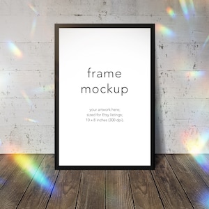 Light leak frame mockup, prism, rainbow, light leak, black frame, wood floor, brick wall, 2:3 aspect ratio, transparent PNG, stock, DOWNLOAD