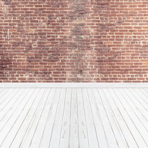 May include: A rustic interior space featuring a weathered red brick wall and a white wooden floor. The brick wall has a textured surface with varying shades of red and brown. The floor is made of white wooden planks.