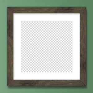 May include: A brown wooden picture frame with a white mount and a clear, transparent background. The frame is hanging on a green wall.