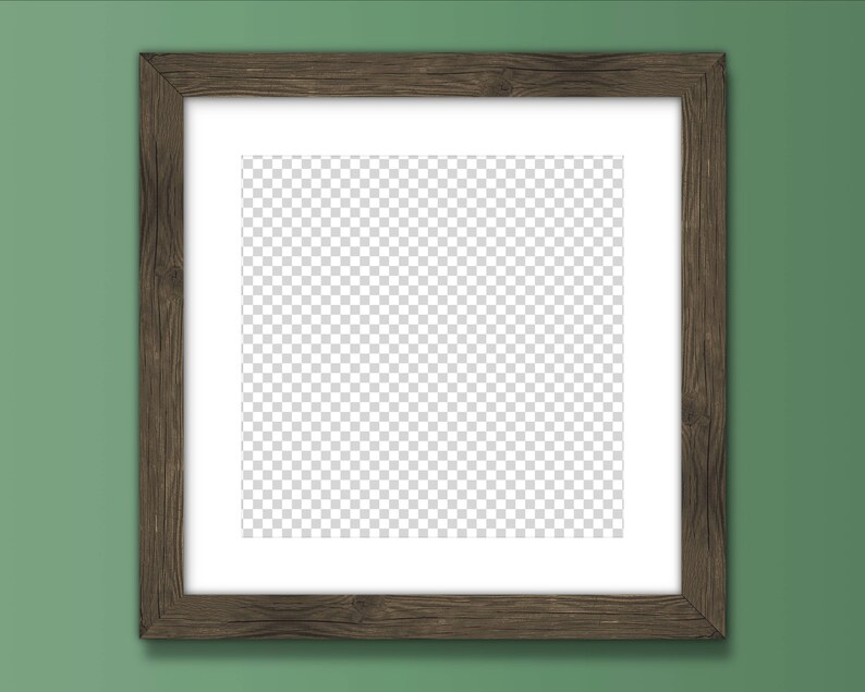 May include: A brown wooden picture frame with a white mount and a clear, transparent background. The frame is hanging on a green wall.