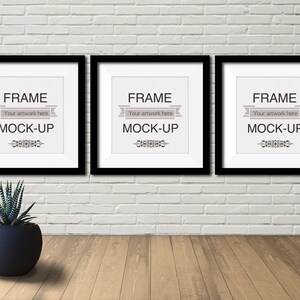 May include: Three black picture frames with white mats and the text "FRAME Your artwork here MOCK-UP" are hanging on a white brick wall. A small potted succulent plant is in the foreground.