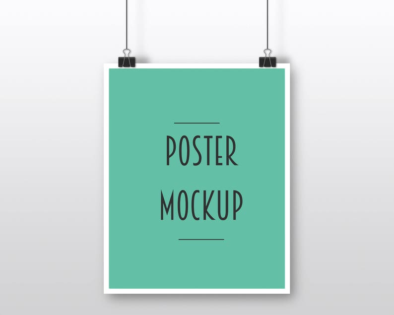 May include: A white poster mockup hanging from two clips against a white wall. The poster has a light green background with the text "POSTER MOCKUP" in black.