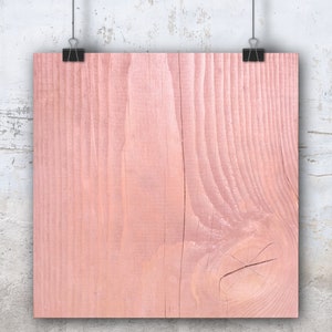 Puede incluir: Primer plano de un fondo de madera de color rosa claro. La madera tiene un veteado natural y una superficie lisa.