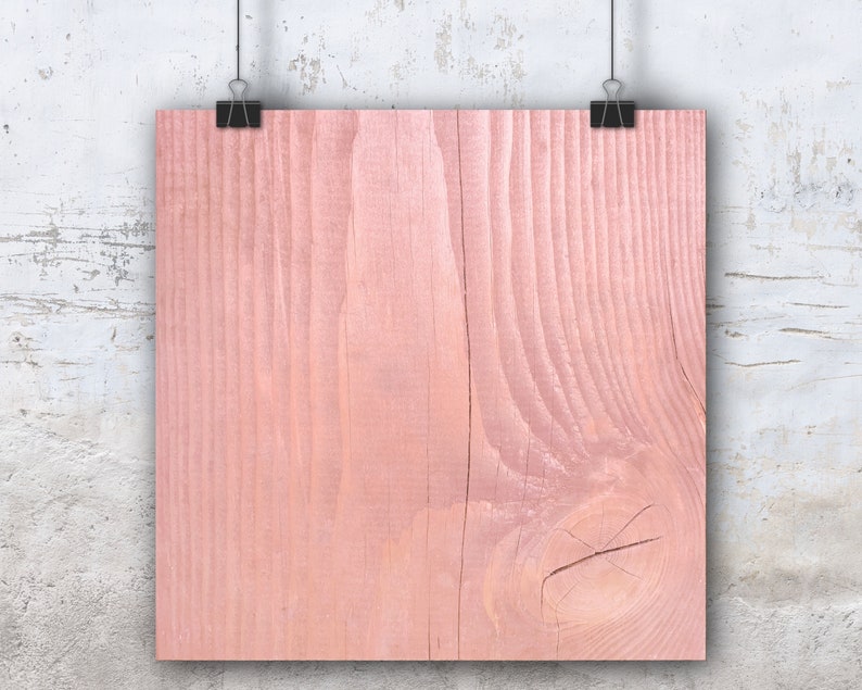 Puede incluir: Primer plano de un fondo de madera de color rosa claro. La madera tiene un veteado natural y una superficie lisa.