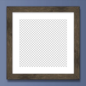 May include: A brown wooden picture frame with a white mount and a clear, transparent background. The frame is on a blue wall.