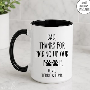 May include: White ceramic mug with a black handle and interior. The mug features the text "DAD, THANKS FOR PICKING UP OUR P**P. LOVE, TEDDY & LUNA" in black. Paw prints are also included in the design. The mug is a gift for a dog dad.