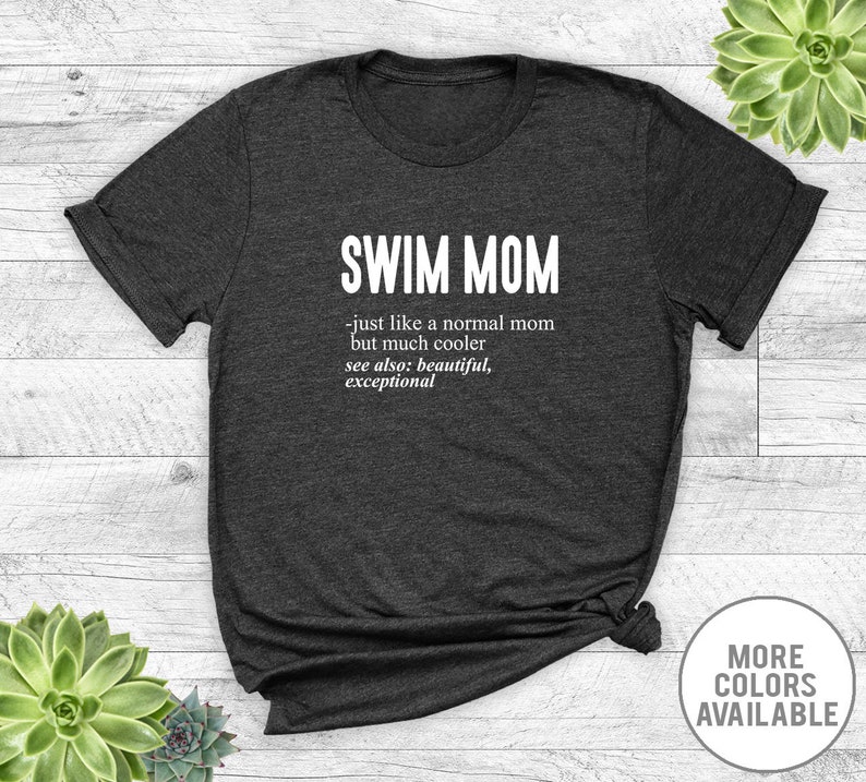 May include: Dark gray t-shirt with white text that reads "SWIM MOM - just like a normal mom but much cooler see also: beautiful, exceptional".