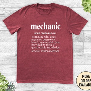 May include: Red t-shirt with a white graphic that says "mechanic" and defines the word as "someone who does precision guesswork based on unreliable data provided by those of questionable knowledge. See also: wizard, magician."