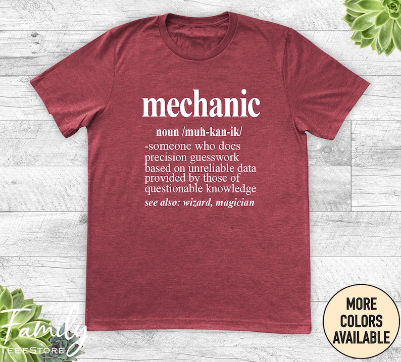 May include: Red t-shirt with a white graphic that says "mechanic" and defines the word as "someone who does precision guesswork based on unreliable data provided by those of questionable knowledge. See also: wizard, magician."