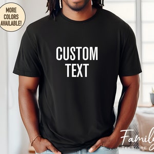 May include: A black t-shirt with the text "CUSTOM TEXT" printed in white on the front.