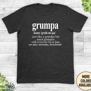 May include: A dark gray t-shirt with white text that reads "grumpa noun /gruh-m-pa/ -just like a grandpa but much grumpier -still everyone loves him see also: awesome, best friend"