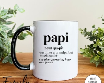 May include: White ceramic mug with a black handle and rim. The mug has a black graphic that reads "papi" with a definition: "noun /pa-pi/ -just like a grandpa but much cooler see also: protector, hero and friend"