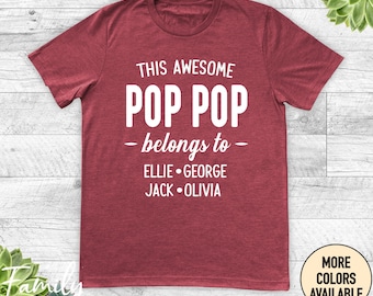 May include: Red t-shirt with white text that reads "This Awesome Pop Pop belongs to Ellie George Jack Olivia".