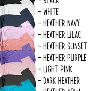 May include: A variety of t-shirt colors, including black, white, heather navy, heather lilac, heather sunset, heather purple, light pink, dark heather, and heather aqua.