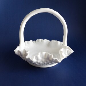 Fenton No 3735 milk glass hobnail basket.