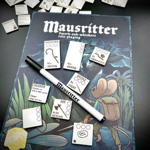 May include: A set of wooden game cards for the Mausritter role-playing game. The cards feature illustrations of various weapons and items, including a hookarm, a needle, an axe, and an improvised weapon. The cards are labelled with their names and stats, such as "d10 Heavy" and "d6 Light".
