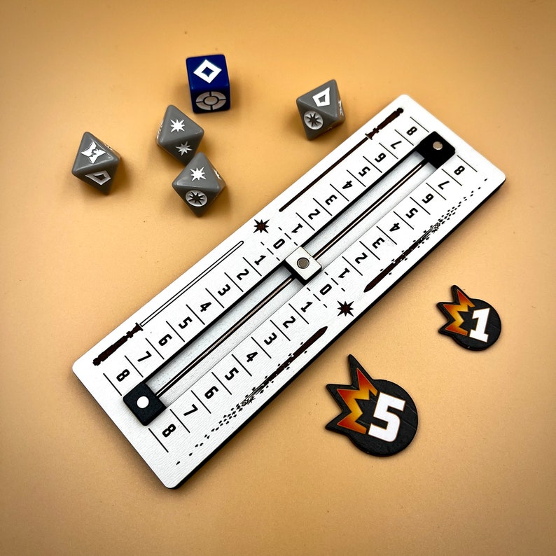 May include: A white wooden board with a sliding scale marked with numbers 1 through 9. The board is used for a game with dice. There are several gray dice with white symbols on them and a blue die with a white symbol on it. There are also two orange and black tokens with the numbers 1 and 5 on them.