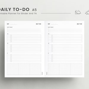 May include: A printable daily to-do list planner in A5 size. The planner has two pages with sections for date, don't forget, and a list of tasks with checkboxes. The bottom of each page has a grid section.