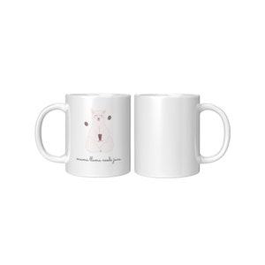 May include: White ceramic mug with a cartoon llama meditating and holding a cup of coffee. The text "mama llama needs java" is printed on the mug.
