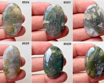 May include: Six oval-shaped green moss agate cabochons with varying patterns of green, white, and brown. The cabochons are labeled B5216, B5217, B5218, B5219, B5220, and B5221.