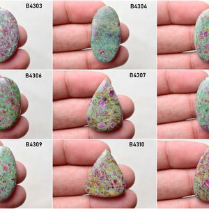 May include: Nine oval and teardrop shaped green and pink gemstones with red and white flecks. The stones are labeled with numbers B4303, B4304, B4305, B4306, B4307, B4308, B4309, B4310, and B4311.