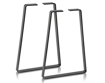 May include: Two black metal table legs with a trapezoidal frame design. Each leg features a flat horizontal base, two angled vertical supports, and a flat top mounting plate with four pre-drilled holes for attachment to a furniture surface.