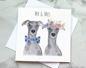 May include: A greeting card with a watercolor illustration of two grey Italian greyhounds. The greyhound on the left is wearing a blue bow tie with white polka dots. The greyhound on the right is wearing a flower crown. The card says "Mr & Mrs" at the top.