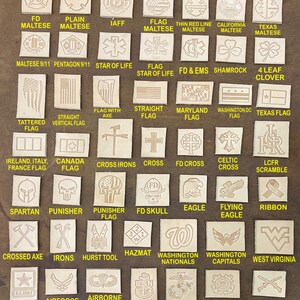 May include: A collection of small, square leather patches with various designs. The patches feature images such as flags, military emblems, and symbols like a shamrock, eagle, and cross. Text includes "FD Maltese", "Army", and "Coast Guard".