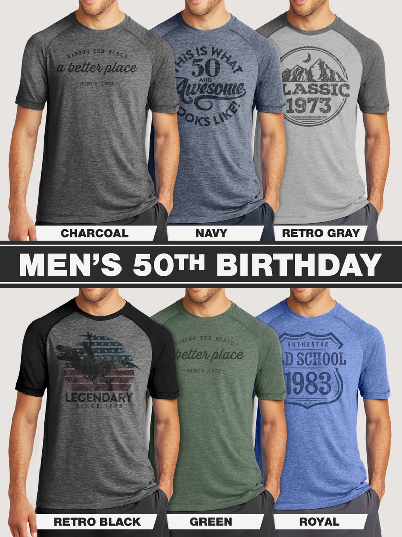 May include: A collection of six short-sleeved t-shirts in various colors, including charcoal, navy, and green. Each shirt features a unique graphic design and text, such as "Making the world a better place" and "50 and Awesome". The shirts are for a 50th birthday.