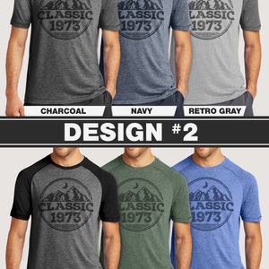 May include: A collection of short-sleeved t-shirts in various colors, including charcoal, navy, and retro gray. Each shirt features a circular graphic with mountain and moon imagery, and the text "CLASSIC 1973". The design is repeated on other shirts in retro black, green, and royal blue.