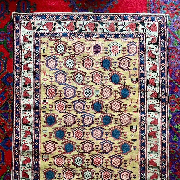 Caucasian Gendje rug with repetition of colourful "boteh" design - Vintage