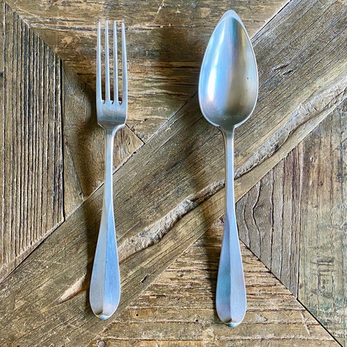 Set of four shops pairs of silver spoons and forks