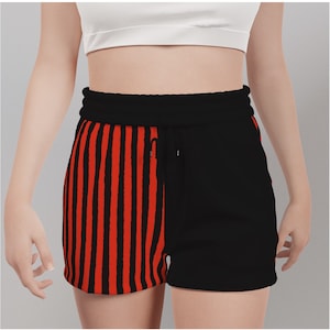 May include: Black and red striped shorts with a black waistband and drawstring. The shorts are made of a soft, comfortable fabric.