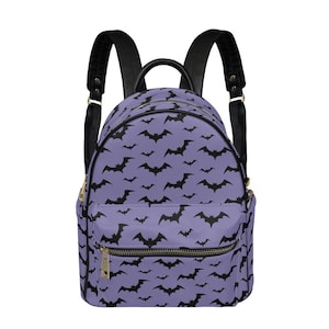 May include: Purple backpack with black bat silhouettes printed all over. The backpack has black straps and gold zipper pulls.