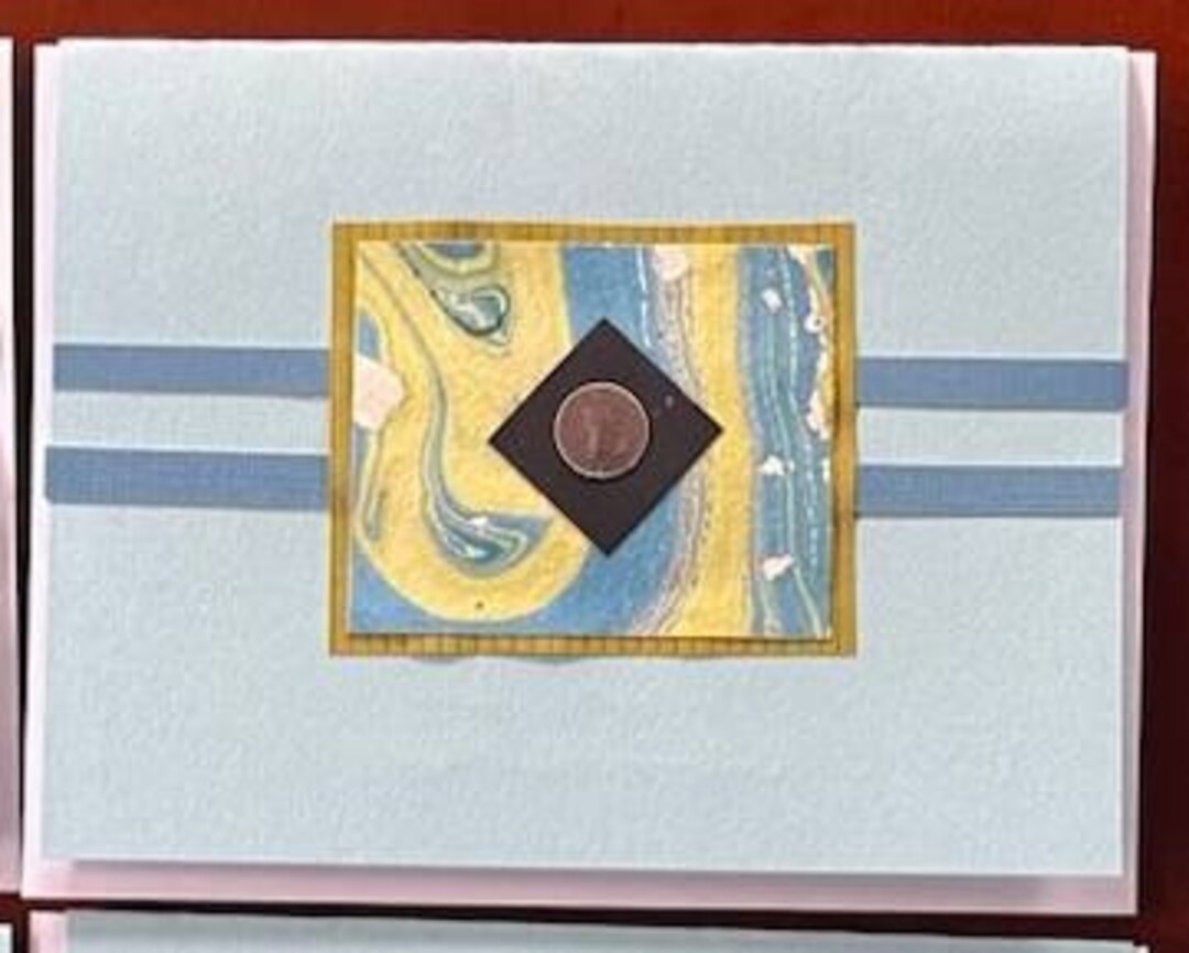 Set of 6 blank handmade cards with blue and green marbled paper on blue