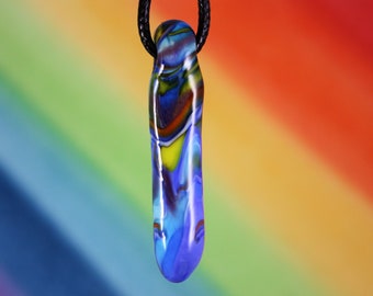 May include: A blue, purple, and yellow glass pendant with a swirling pattern hangs from a black cord. The pendant is shaped like a teardrop and has a glossy finish.