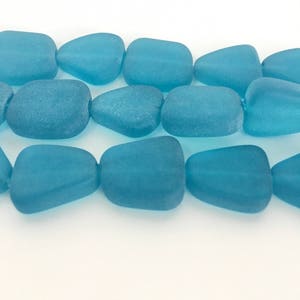 Pacific blue glass cultured seaglass, translucent flat freeform beads, one strand, 6 pieces. Rumbled glass beads. Ocean blue glass beads.
