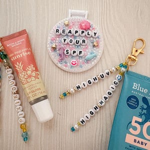 Resort Girl Summer Essentials Set | Compact Mirror + 2 Lip SPF Charms | High UV High Magic + SPF & Pixie Dust | Disney Park Bundle