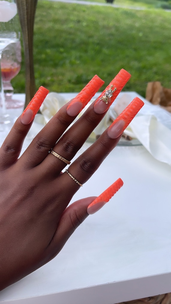 orange baddie nails